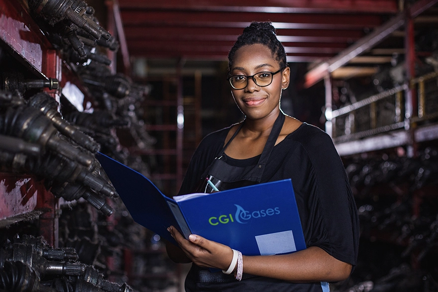 Learn about careers at CGI Gases - Employee holding CGI Gases folder